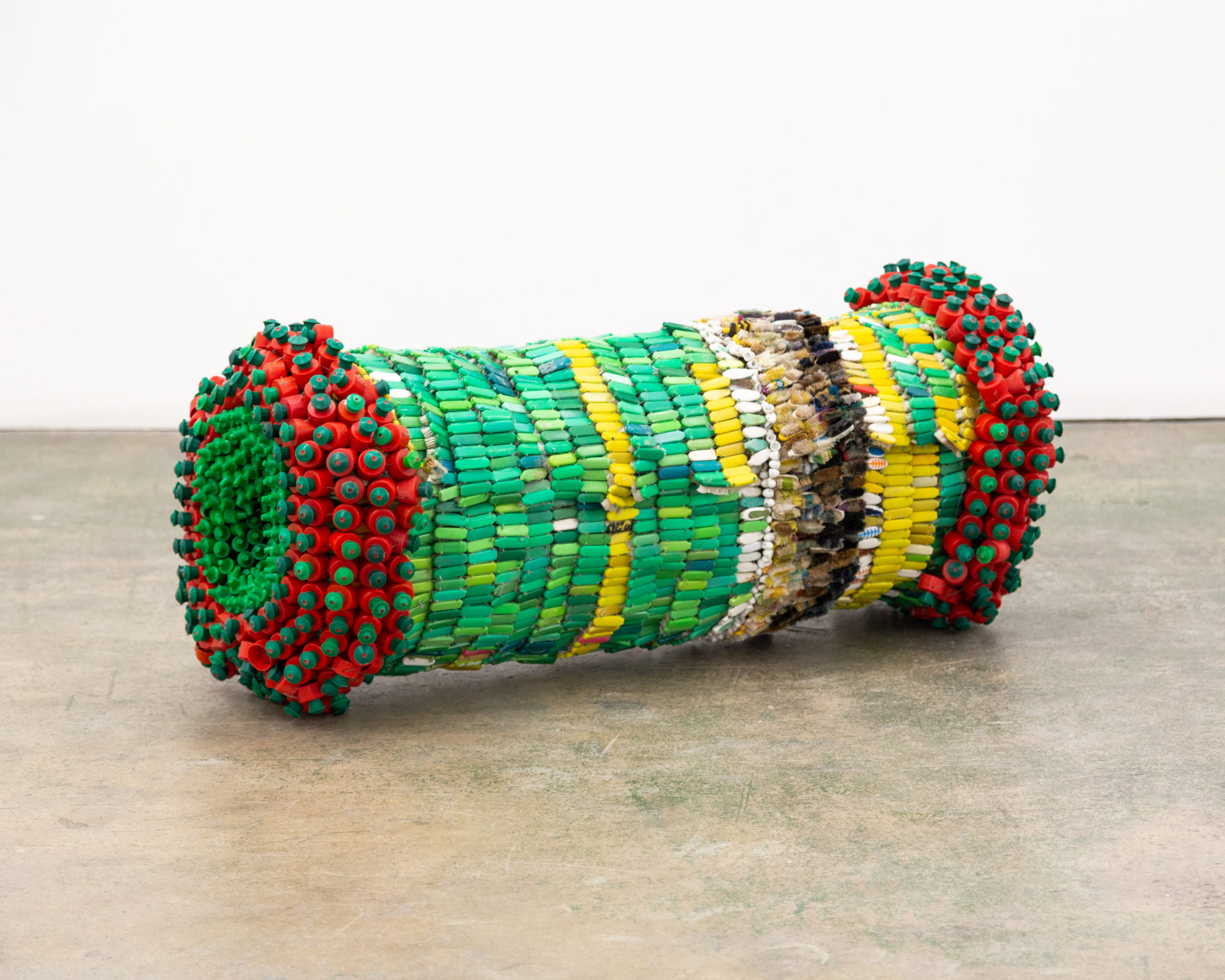 Moffat Takadiwa, Object of Influence (5A), 2021. Toothbrush, Sunlight bottle tops, 59.1 x 19.7 x 19.7 inches. Courtesy of the artist and Nicodim Gallery Los Angeles. Photo: Taylor Tschider.