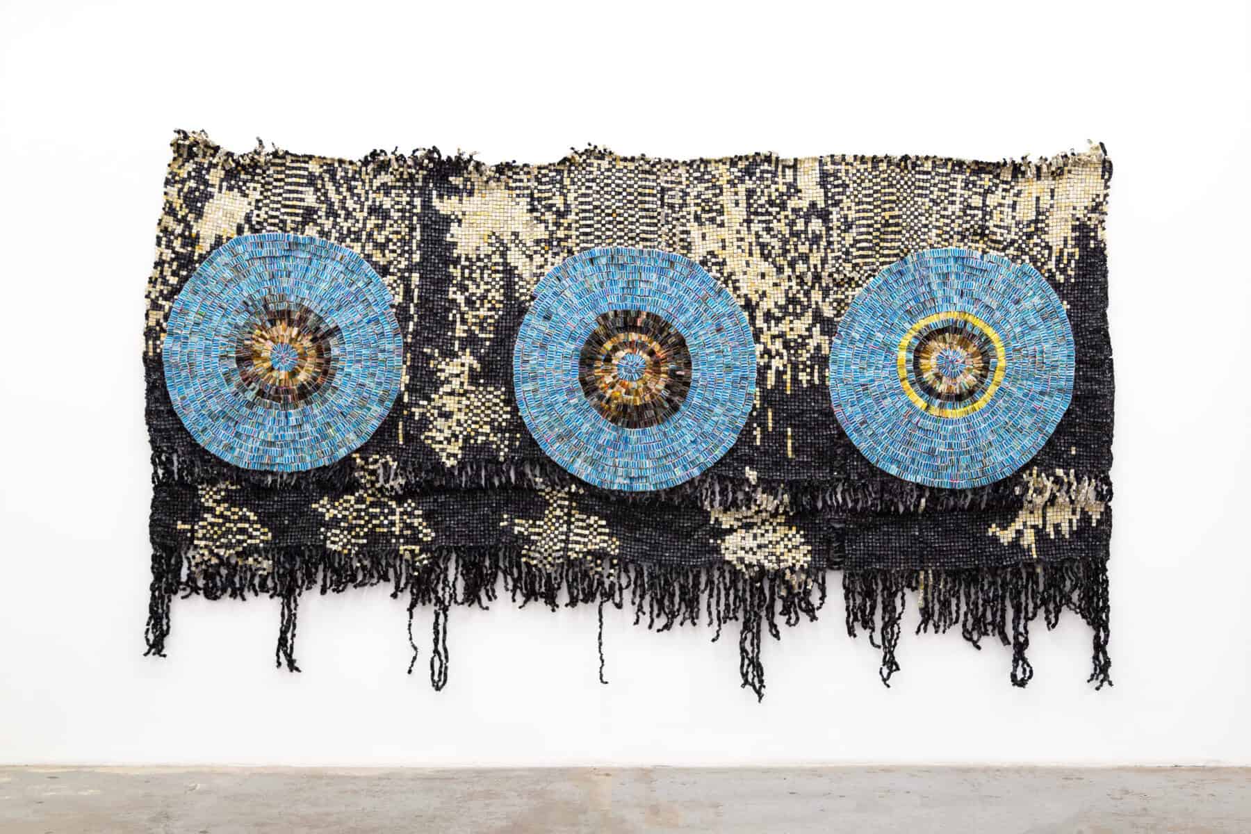 Moffat Takadiwa, Three Little Witches/Karoi, 2021. Found toothbrushes, computer keys, 98.4 x 177.2 x 2 inches. Courtesy of the artist and Nicodim Gallery Los Angeles. Photo: Taylor Tschider.