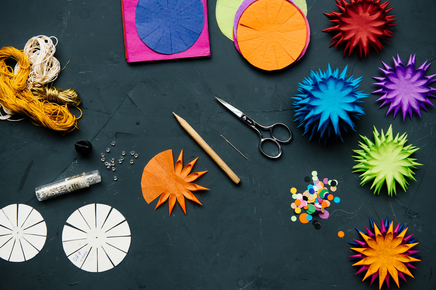 Image of tools and materials used to create paper ornaments.